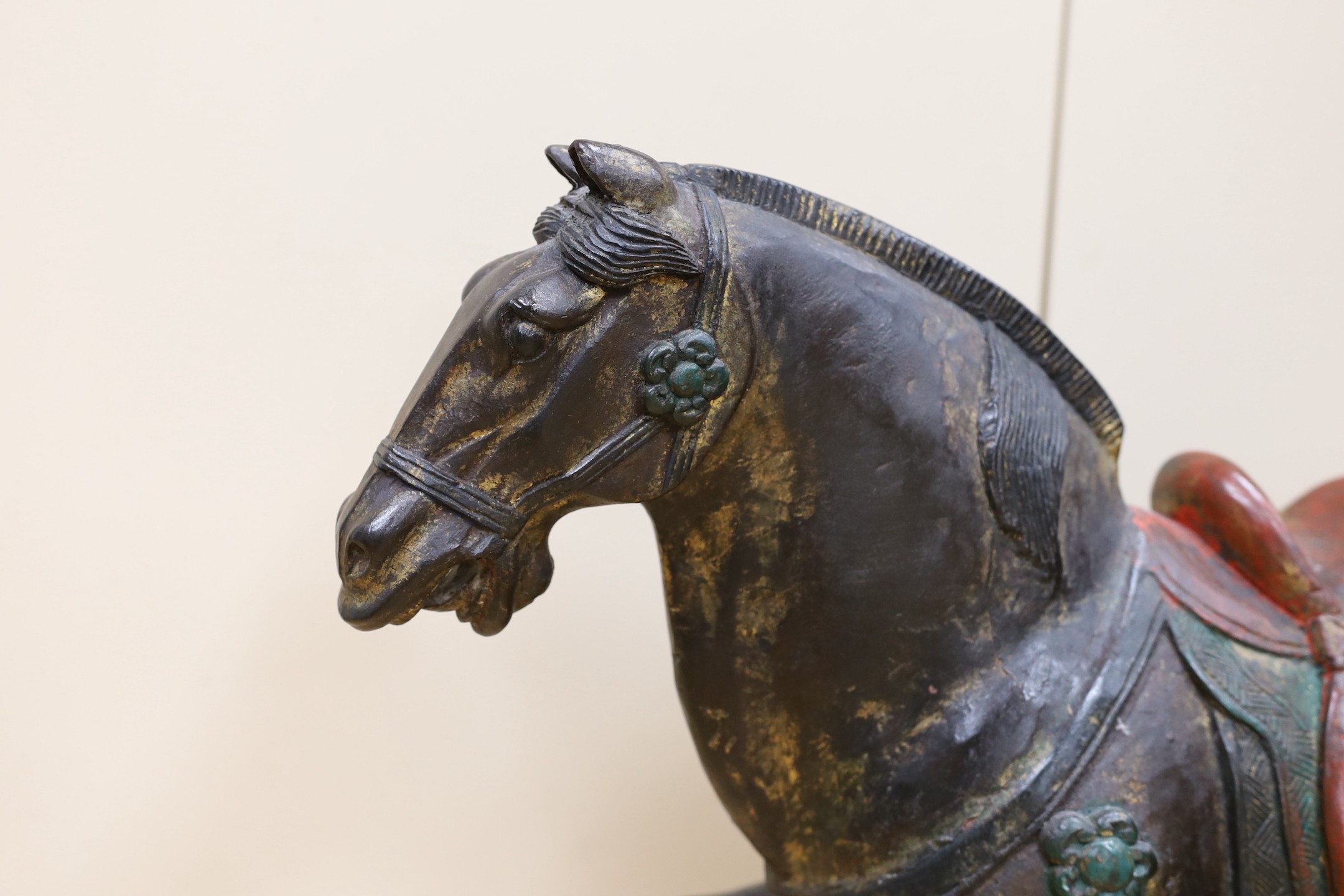 A Chinese carved and painted wood horse, 56cm tall